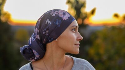 Confident woman with cancer watching sunset 1704982398